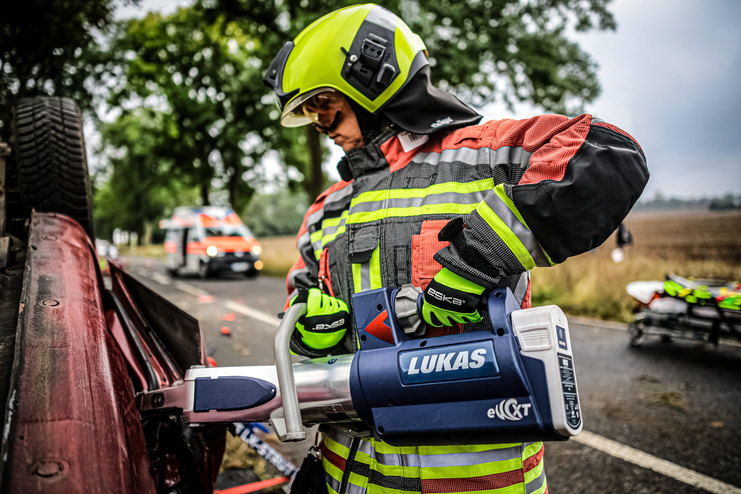 firefighter using rescue tools for vehicles extrication